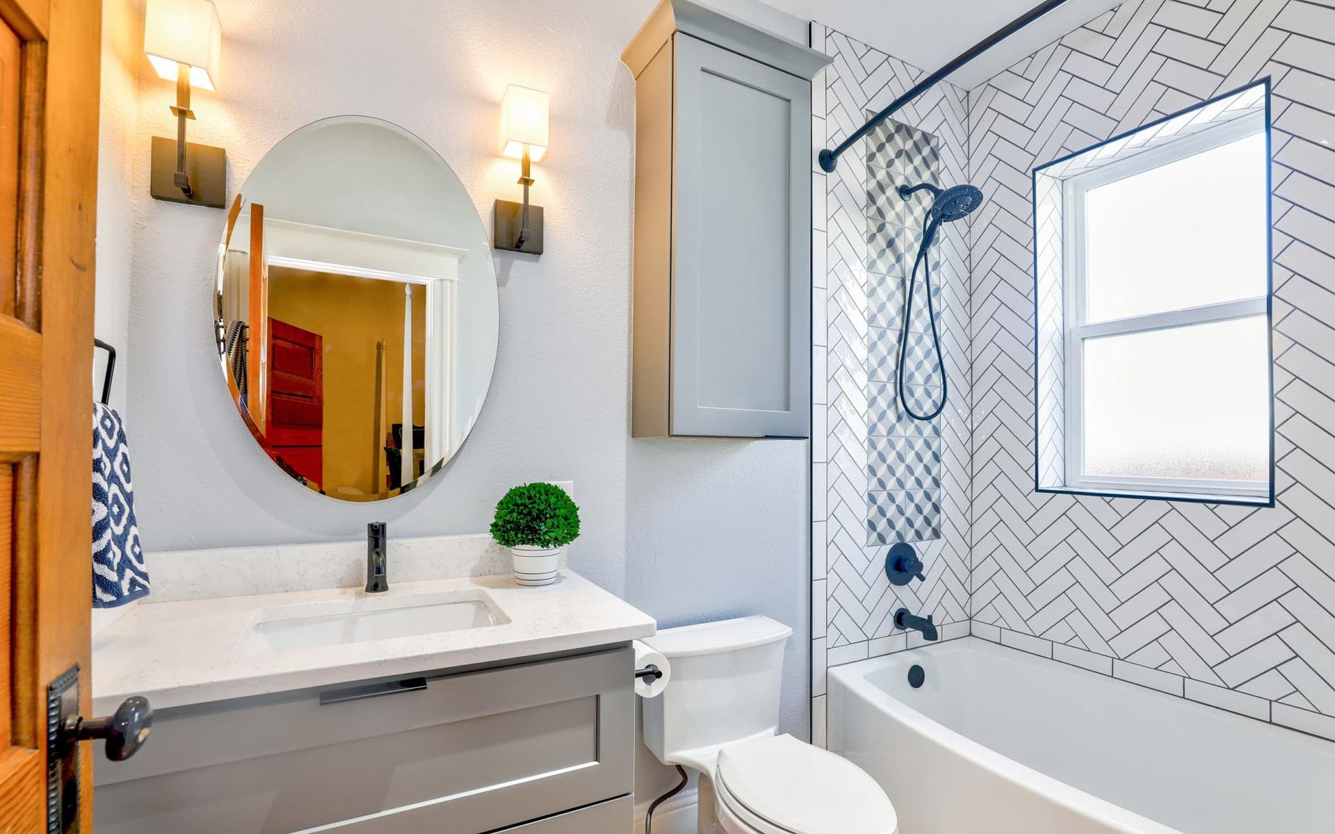Interior Design - modern bathroom with herringbone shower tile and black fixtures