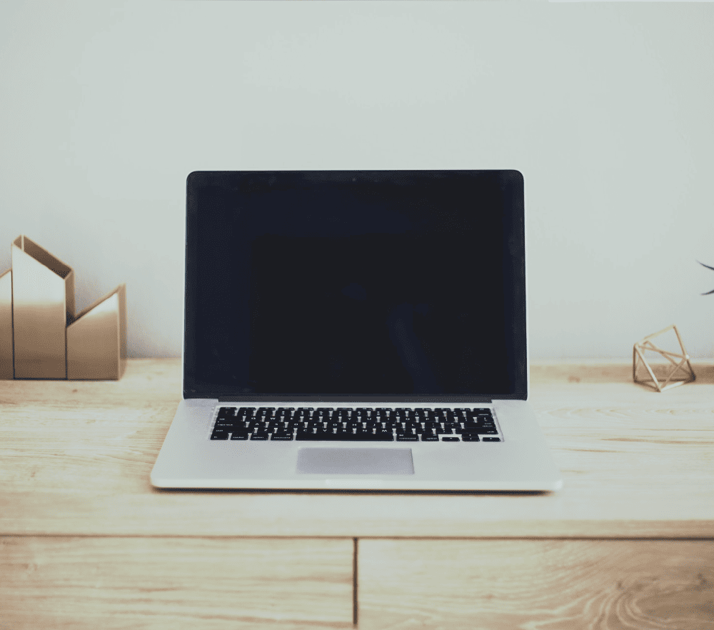 apple laptop on a desk